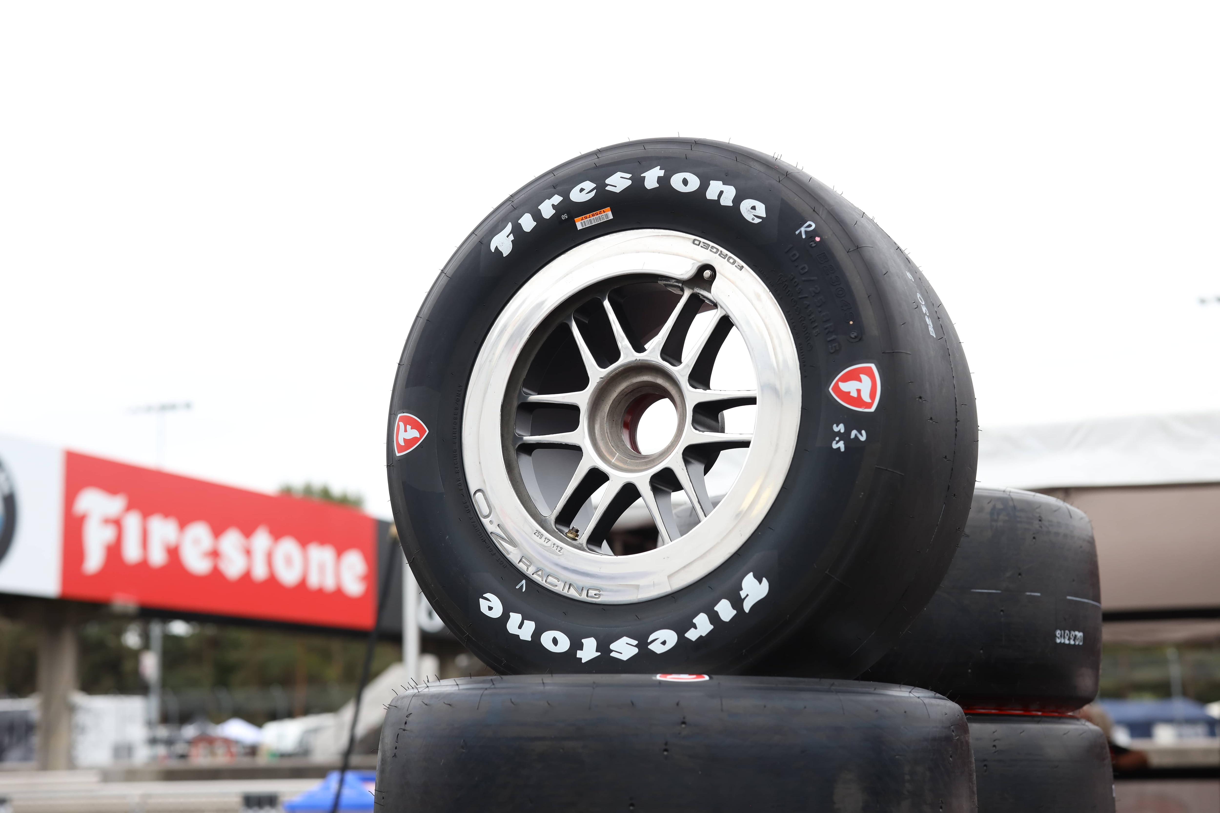 Firestone racing tire on stack of tires
